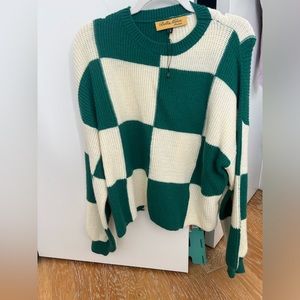 Green and white checkered sweater